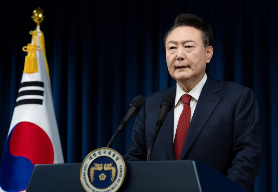 South Korea s Yoon: Embittered survivor staggers on after impeachment vote