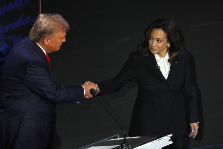 Republican presidential nominee, former U.S. President Donald Trump and Democratic presidential nominee, U.S. Vice President Kamala Harris shake hands as they attend a presidential debate hosted by ABC in Philadelphia, Pennsylvania, U.S., September 10, 20