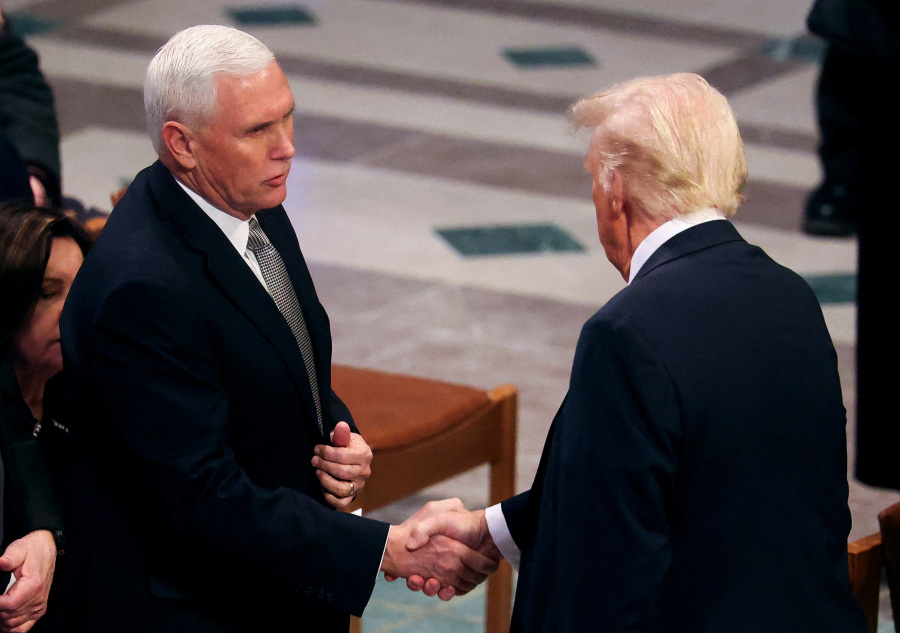 Trump shakes hands with Pence, engages Obama at Carter funeral