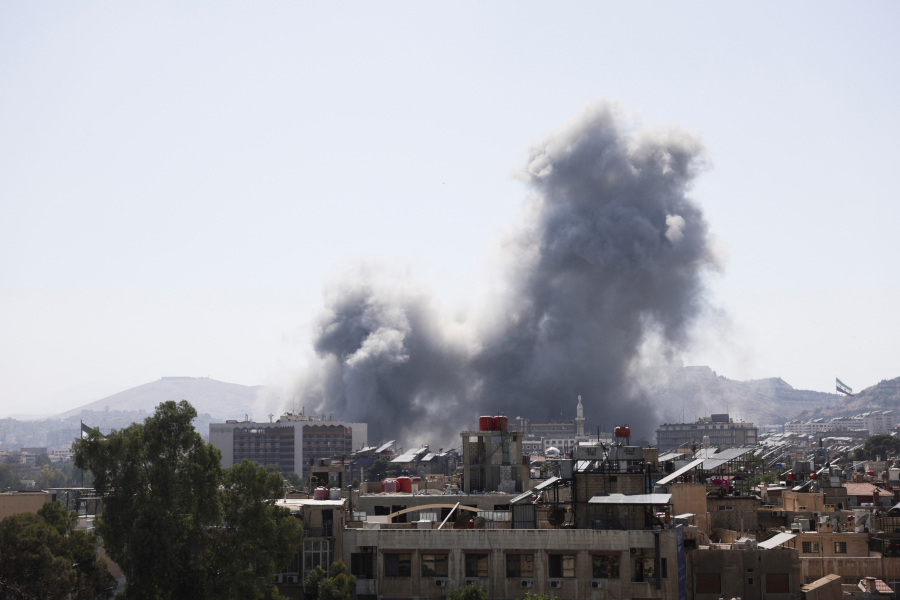 Israel launches heavy airstrikes in Damascus, vowing to shield Druze