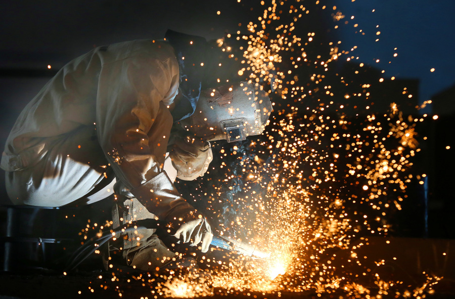 China factory activity shrinks for fourth month in July, PMI shows