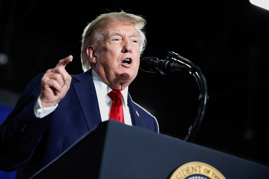 Trump threatens tariffs on all cars and trucks to 50 amid Canada trade spat