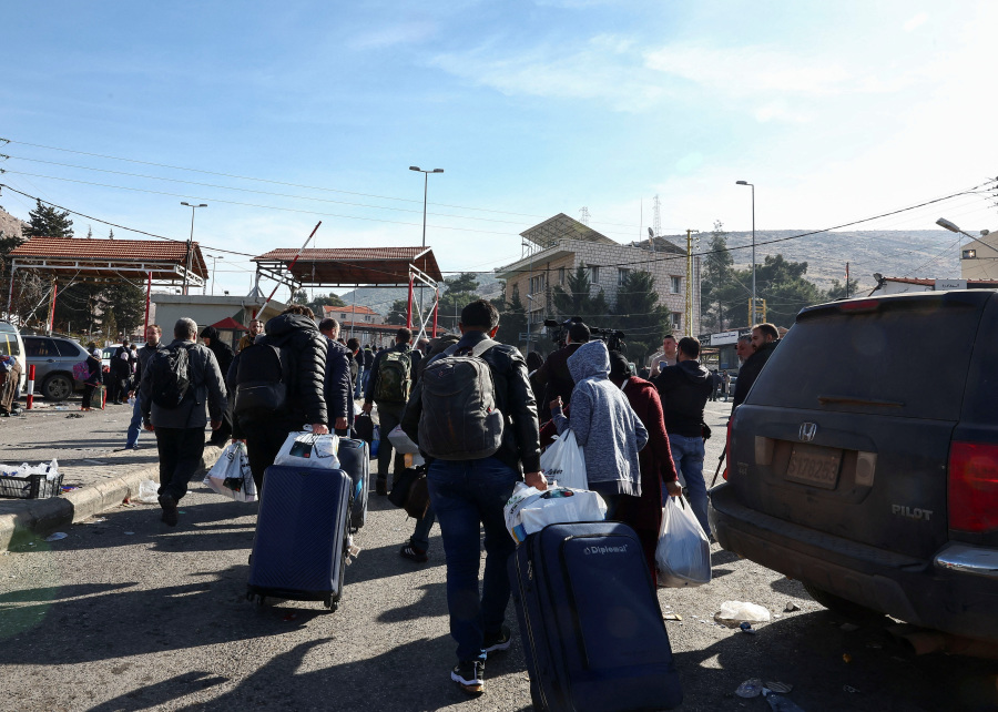 Refugees return to Syria as caretaker prime minister appointed