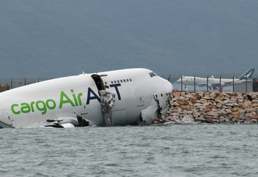 Cargo plane slides off runway in Hong Kong, airport operator says