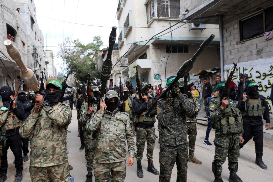 Battling to survive, Hamas faces defiant clans and doubts over Iran