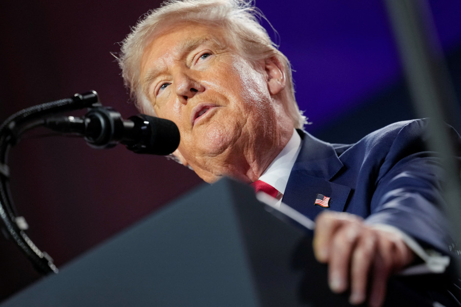 Trump signs order aimed at curbing big-money college sports payouts