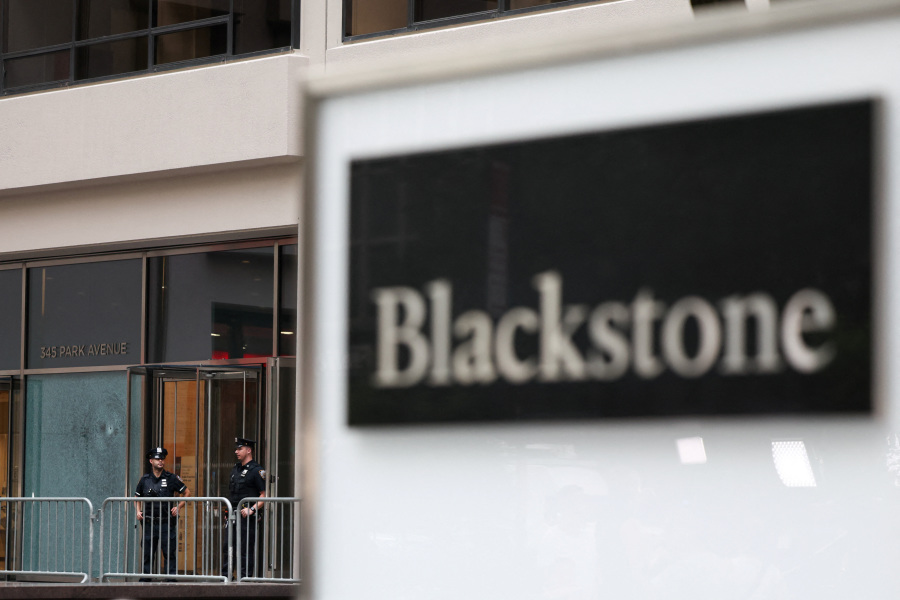 Wall Street returns to work after Manhattan shooting that killed Blackstone executive