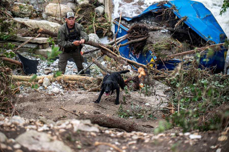 Search for Texas flood victims enters third day, with more rain forecast