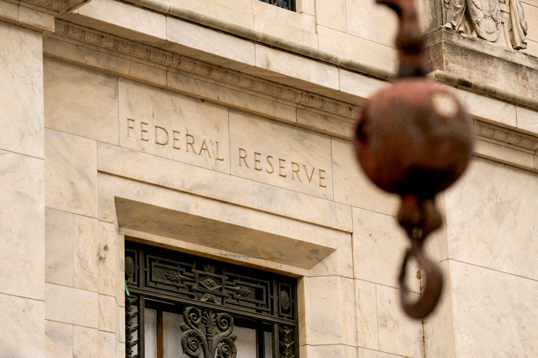 Fed holds rates steady as expected, calls inflation somewhat elevated