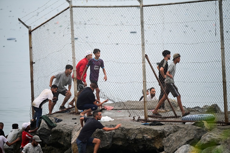 Spain says migrants are returning to Ceuta after 57 killed in border rush