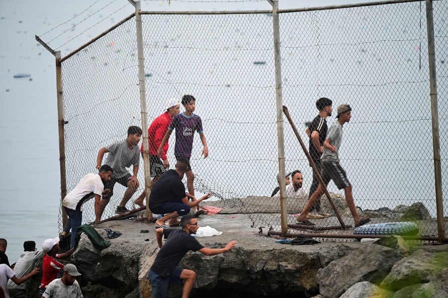 Spain says migrants are returning to Ceuta after 57 killed in border rush