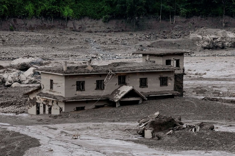 Devastating flash flood on Nepal-Tibet border kills nine, hundreds of tourists missing